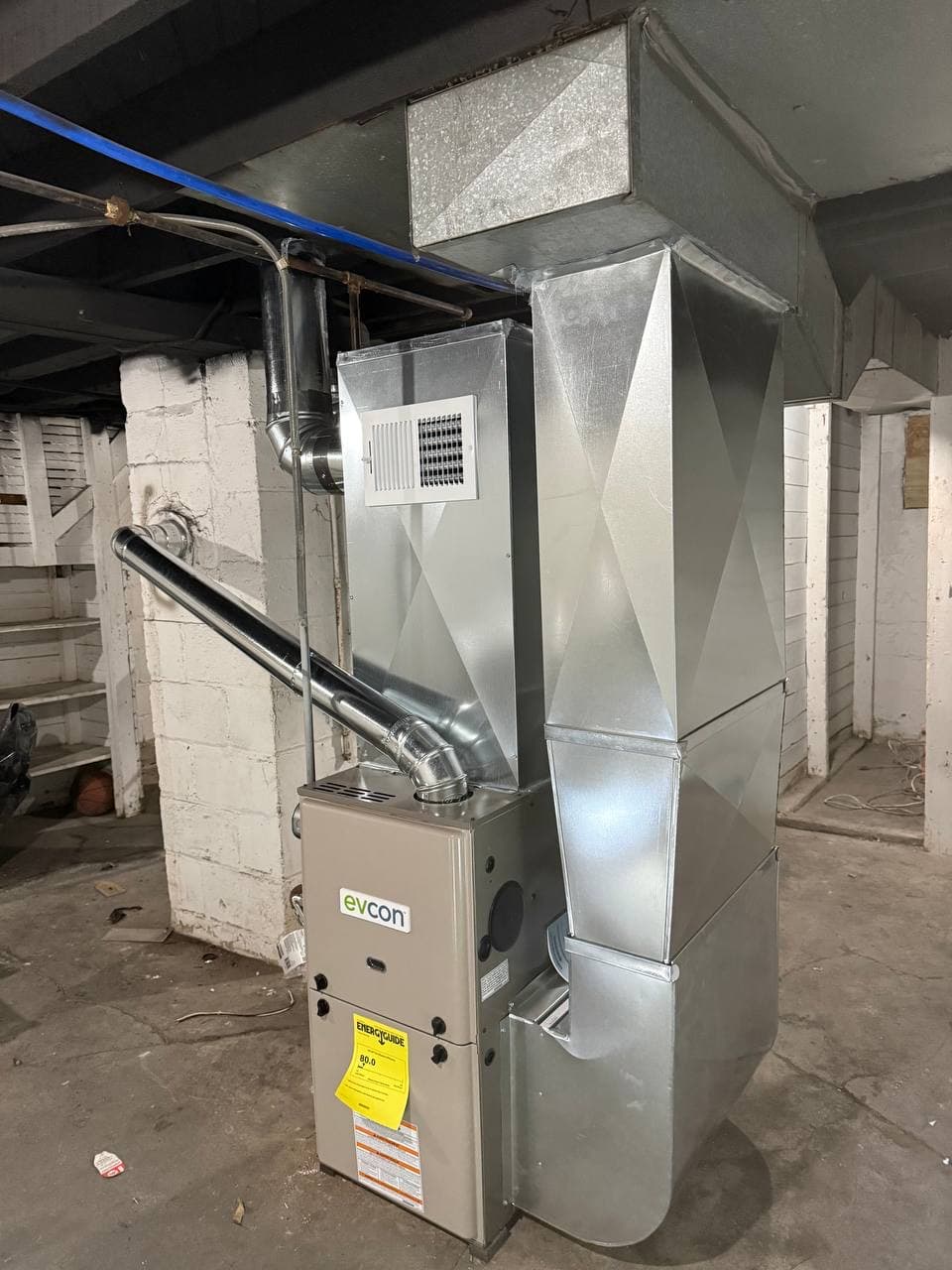 New furnace and ductwork installed in a basement