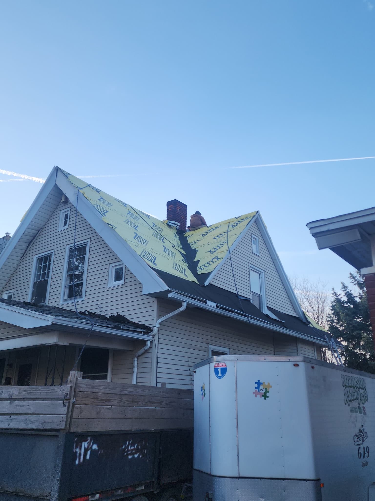 Stripping a roof to the deck and re-felting around the chimney